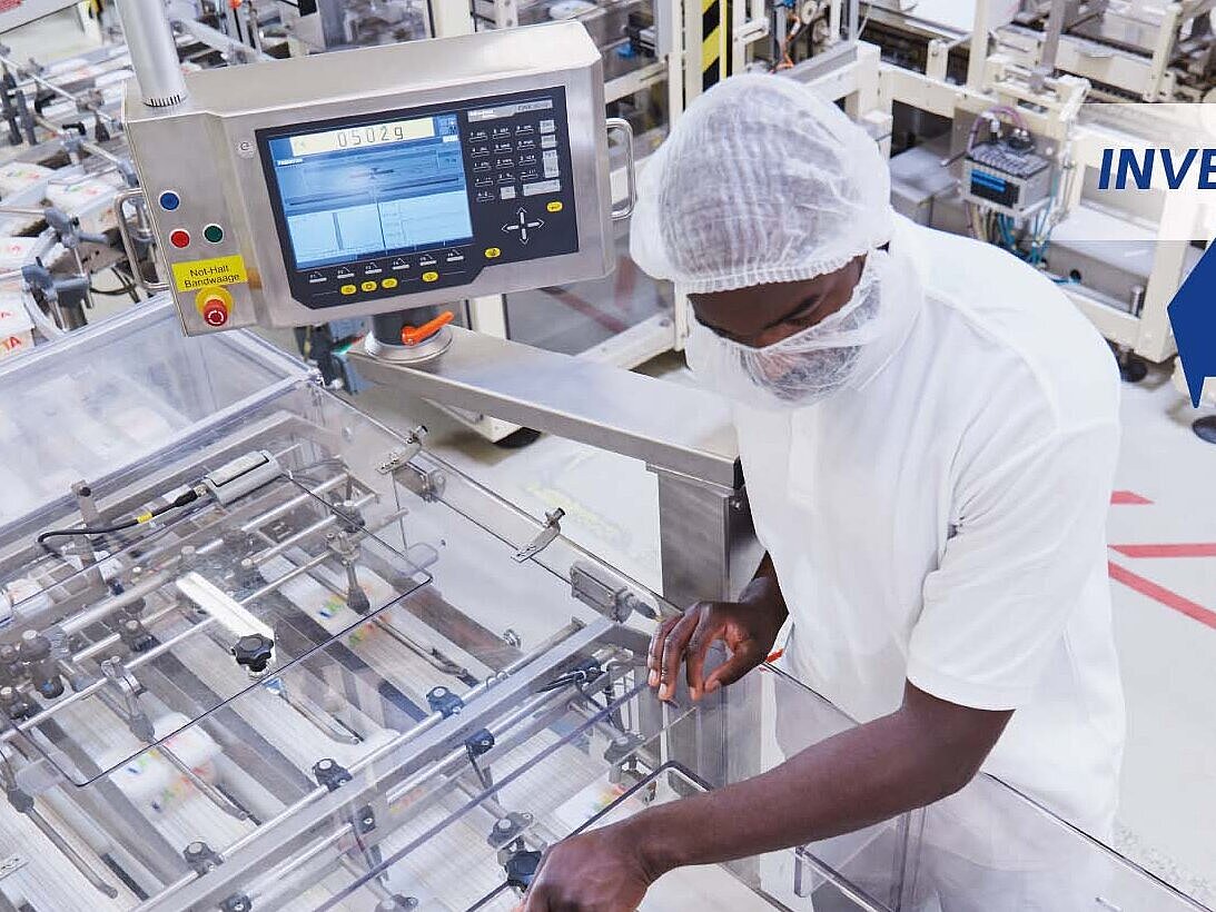 Worker using an industrial scale