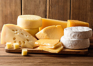 The picture shows a variety of cheeses