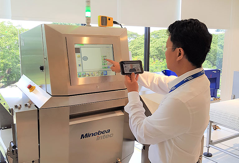 Worker is operating a weighing machine